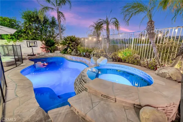 a view of a swimming pool with lounge chair