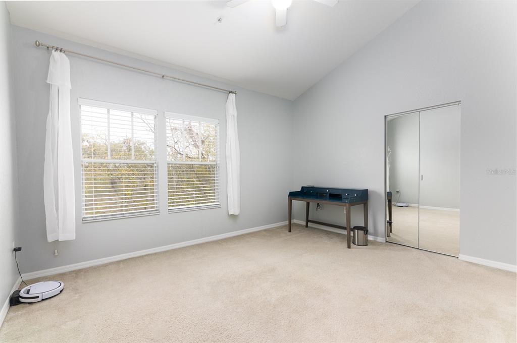 4850 Southwest 91 Terrace, Unit 301 Gainesville, FL 32608 - Photo 10 of 24 a room with a window and a kitchen space