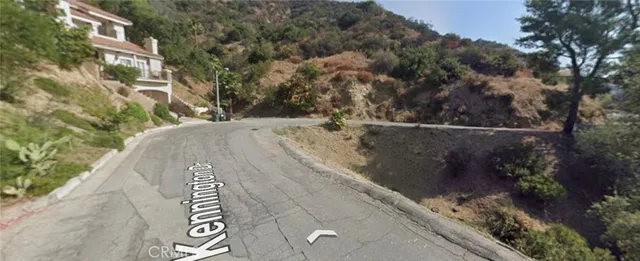 a view of a street with a building in the background