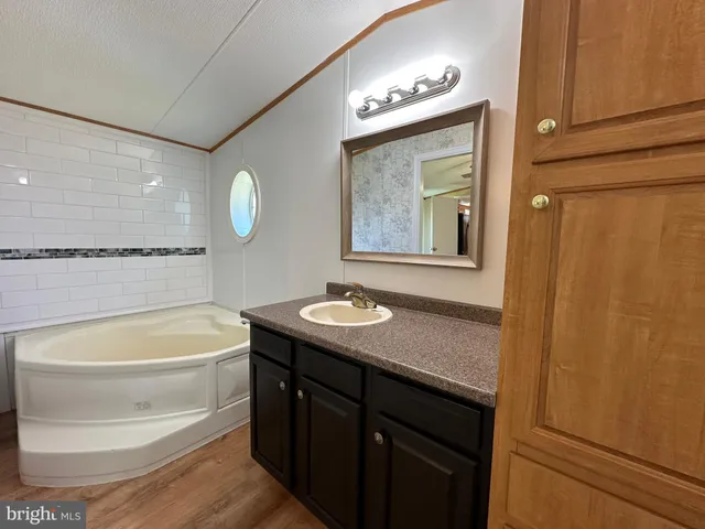 a white bath tub sitting on a shelf
