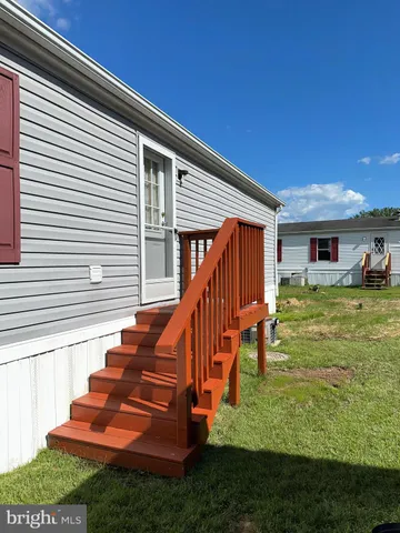 a view of a house with a big yard