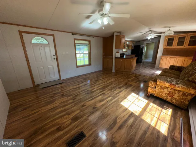 a view of living room with furniture and flat screen tv