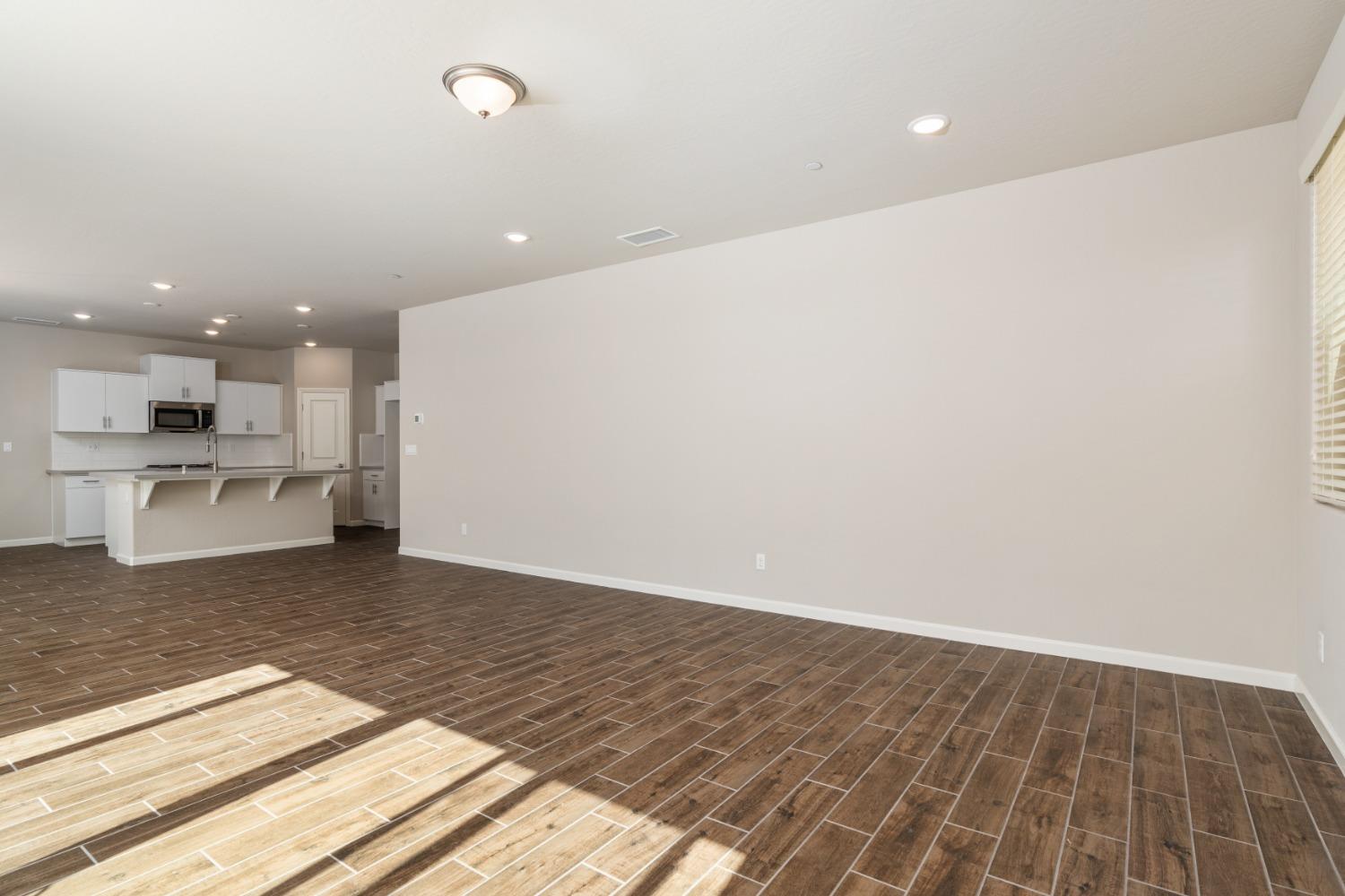 783 Traverse Drive Madera, CA 93636 - Photo 16 of 30 a view of kitchen island wooden floor and kitchen