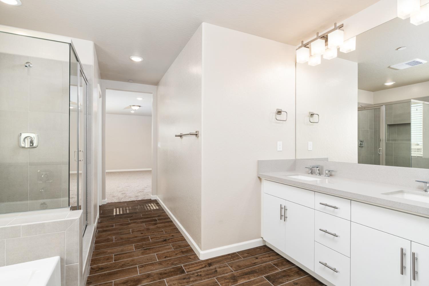 783 Traverse Drive Madera, CA 93636 - Photo 26 of 30 a bathroom with a sink a toilet and shower