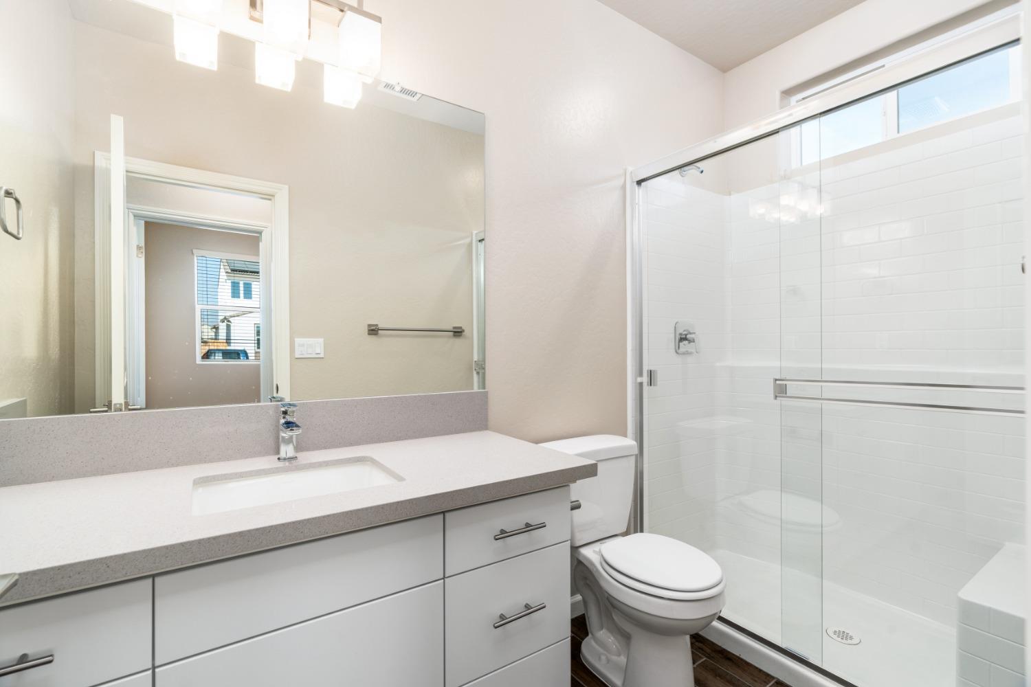 783 Traverse Drive Madera, CA 93636 - Photo 7 of 30 a bathroom with a sink toilet and a mirror