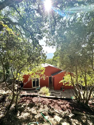 a kitchen with a sink a counter and cabinets