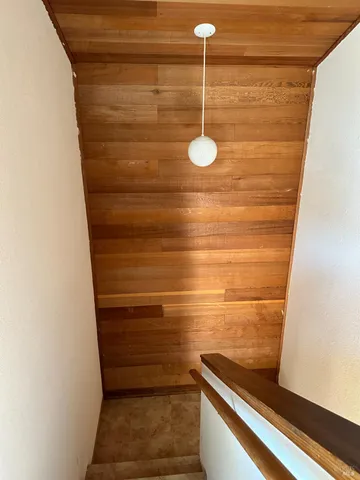 a view of a livingroom with fireplace and furniture