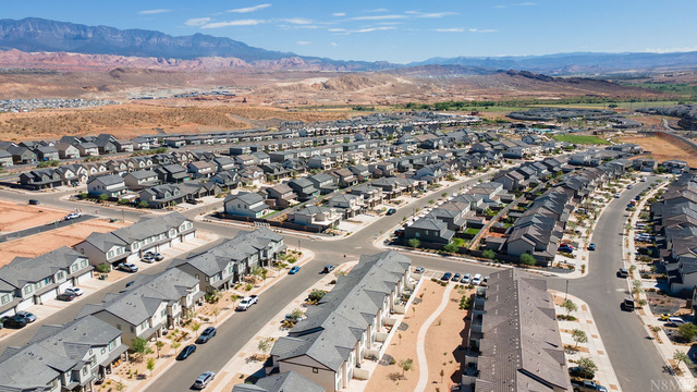 1693 Devils Gdn Lane Washington, UT 84780 - Photo 4 of 64 Expansive residential community featuring a variety of single-family homes and townhomes with gray roofing