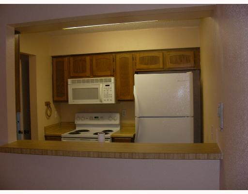 6702 Everhart Road, Unit 109T Corpus Christi, TX 78413 - Photo 3 of 5 a bathroom with a sink and a mirror