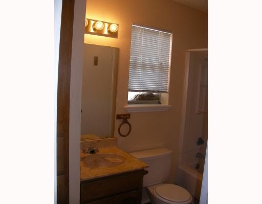 6702 Everhart Road, Unit 109T Corpus Christi, TX 78413 - Photo 5 of 5 a bathroom with a sink a toilet and shower