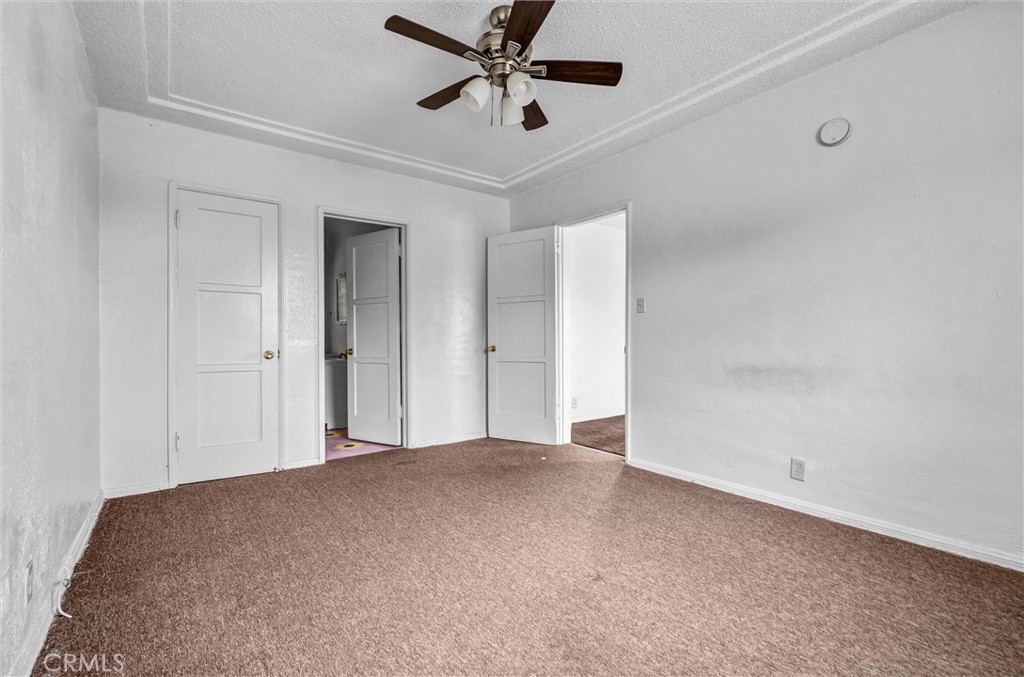 2112 South Burnside Avenue Los Angeles, CA 90016 - Photo 18 of 26 a view of an empty room and chandelier fan