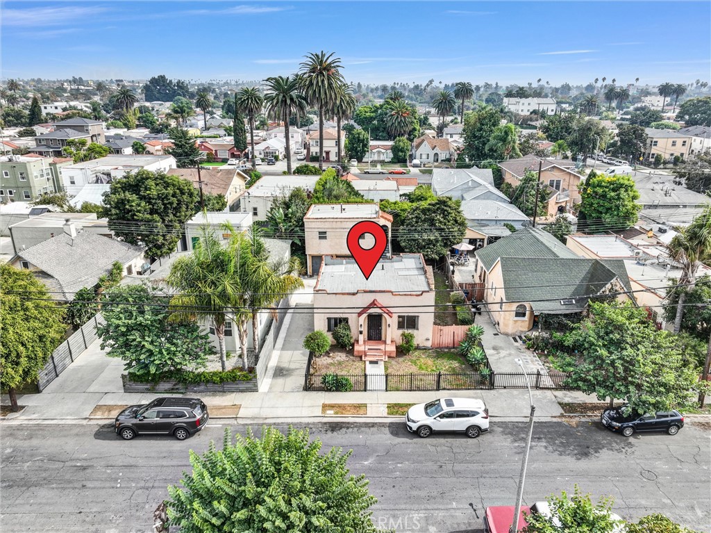 2112 South Burnside Avenue Los Angeles, CA 90016 - Photo 22 of 26 an outdoor space with lots of cars parked on the road