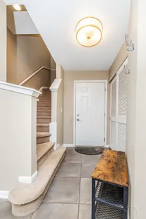 a bedroom with a bed and a potted plant