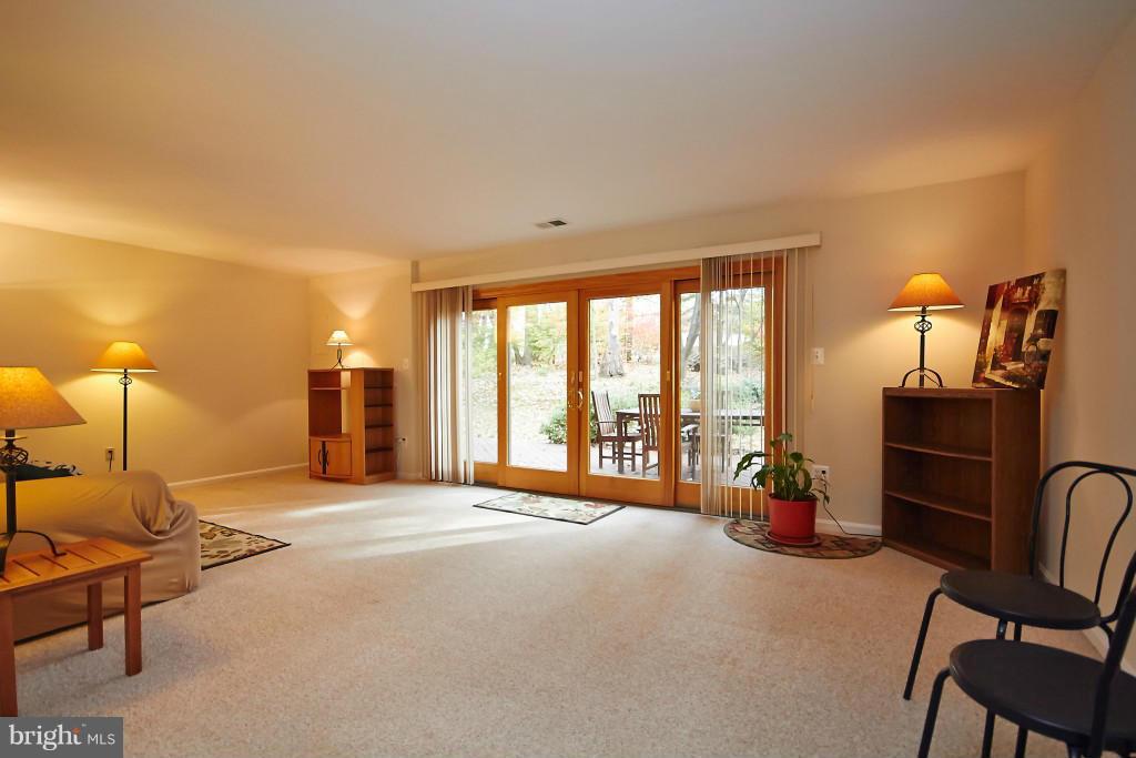 11008 Saffold Way Reston, VA 20190 - Photo 5 of 24 a bedroom with furniture and large windows