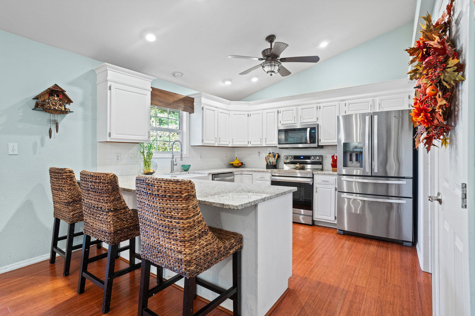 1 Morfey Court Monticello, IL 61856 - Photo 11 of 61 a kitchen with stainless steel appliances granite countertop a kitchen island hardwood floor and a sink