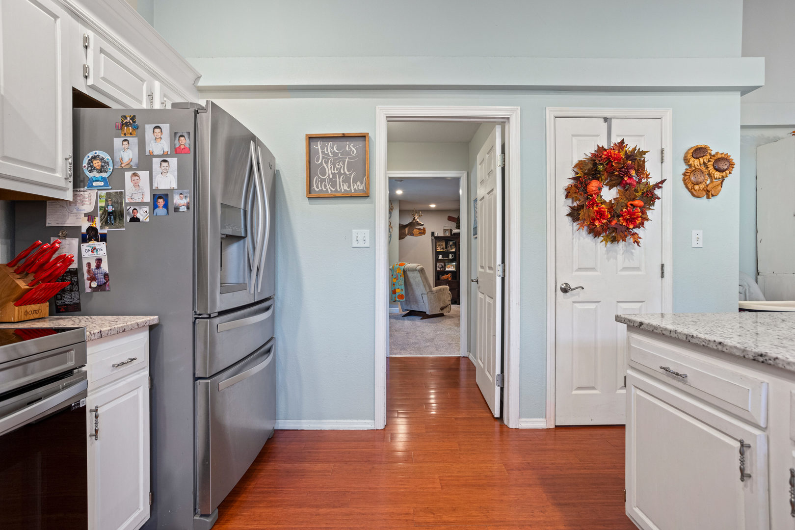 1 Morfey Court Monticello, IL 61856 - Photo 15 of 61 a view of a kitchen with fridge and wooden floor