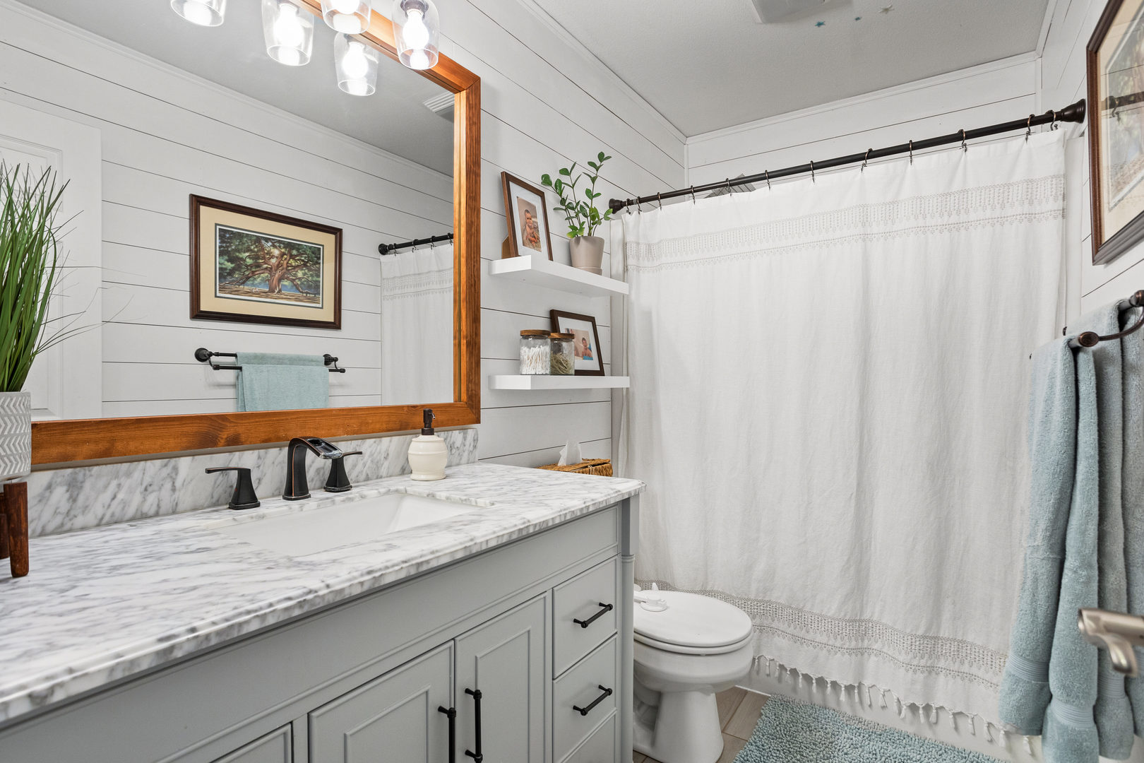 1 Morfey Court Monticello, IL 61856 - Photo 42 of 61 a bathroom with a granite countertop sink a toilet and a large mirror