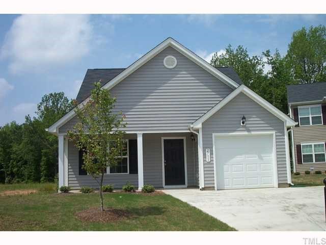 2711 Brownlow Court Raleigh, NC 27610 - Photo 1 of 11 a front view of a house with a garden