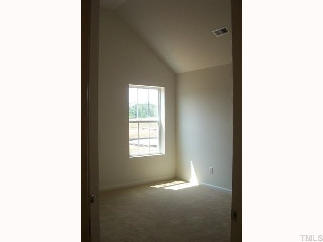 2711 Brownlow Court Raleigh, NC 27610 - Photo 8 of 11 a view of an empty room with a window