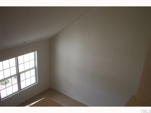 2711 Brownlow Court Raleigh, NC 27610 - Photo 9 of 11 a view of an empty room and window