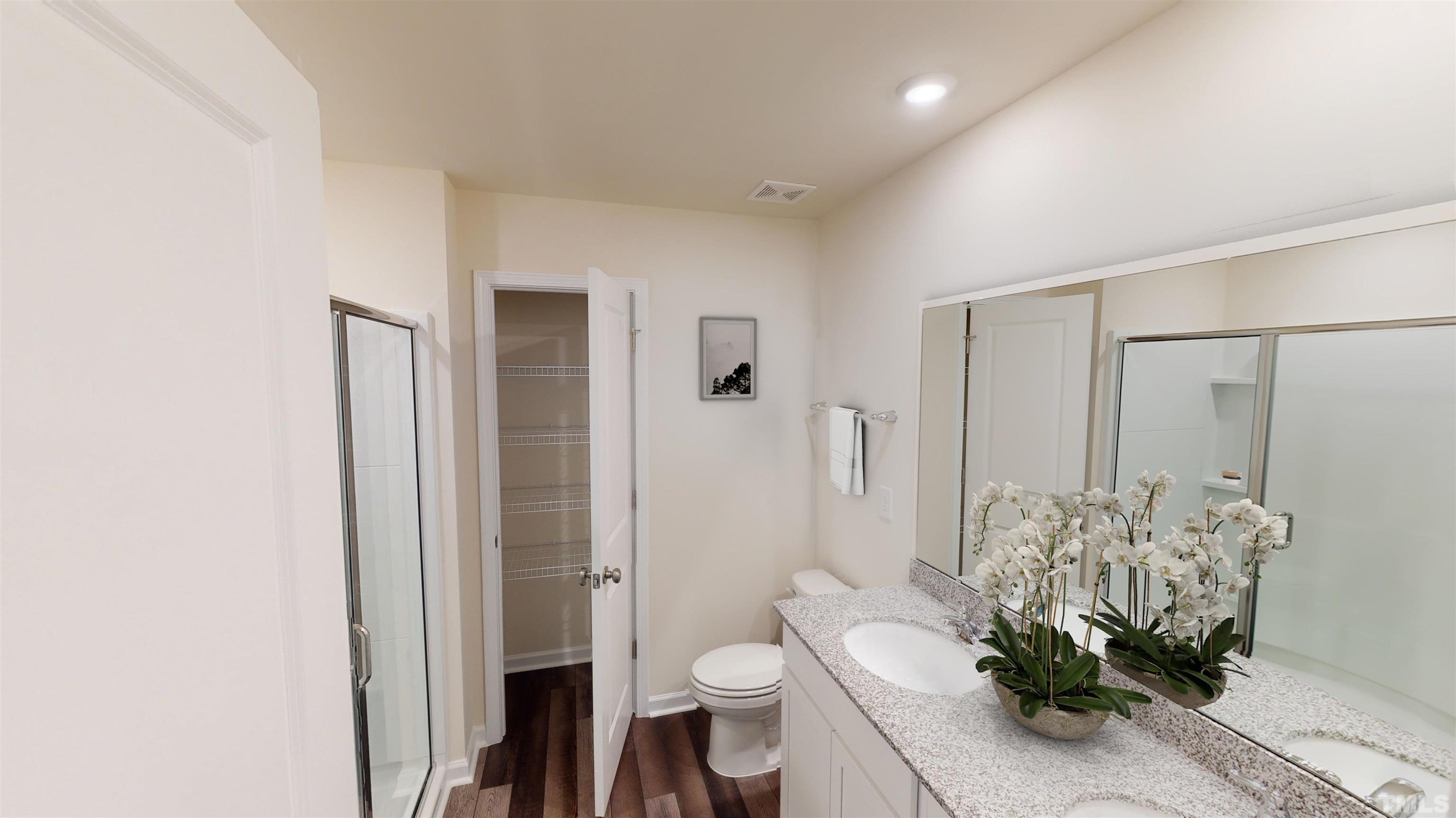 1533 Heron Pond Street Raleigh, NC 27604 - Photo 10 of 32 a bathroom with a toilet sink and shower