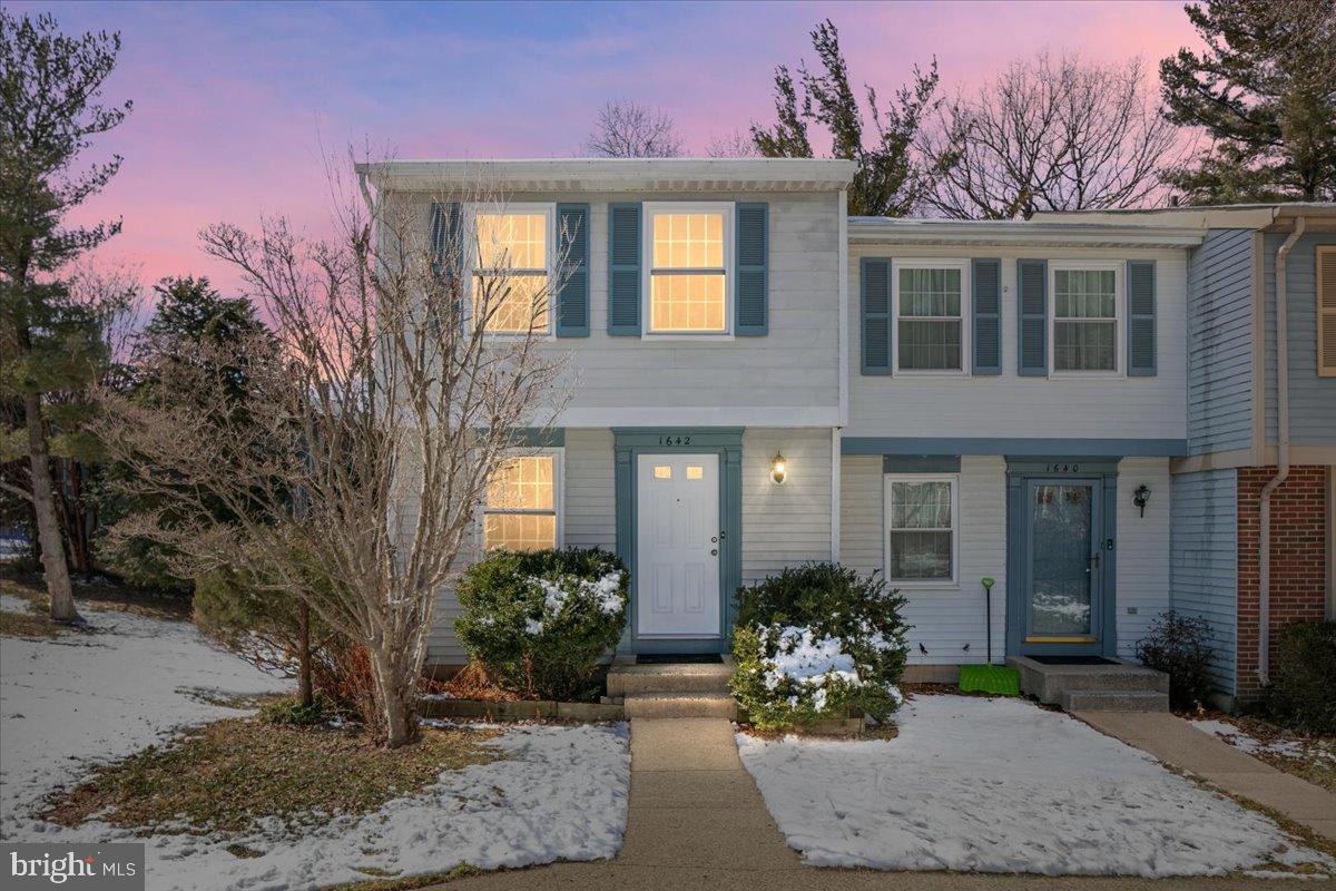 1642 Harvest Green Court Reston, VA 20194 - Photo 1 of 46 a view of a brick house with large windows