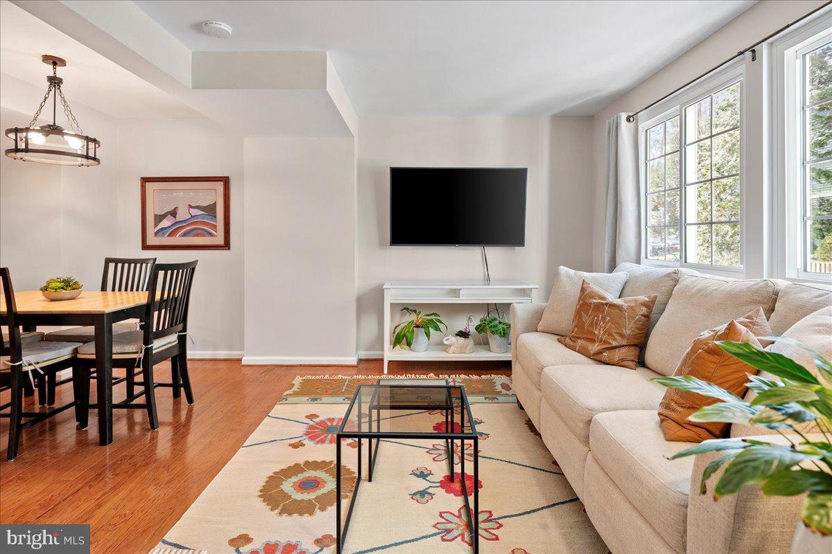 1642 Harvest Green Court Reston, VA 20194 - Photo 19 of 46 a living room with furniture and a flat screen tv