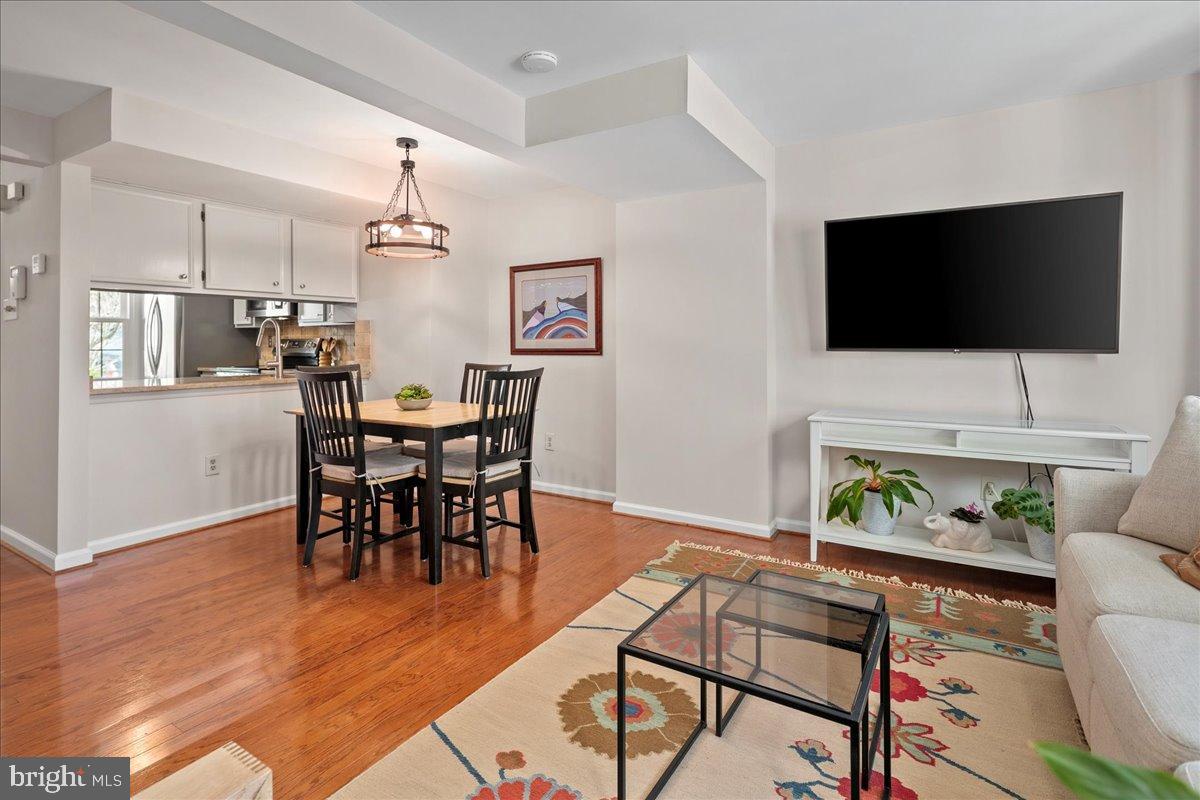 1642 Harvest Green Court Reston, VA 20194 - Photo 20 of 46 a living room with furniture and a flat screen tv