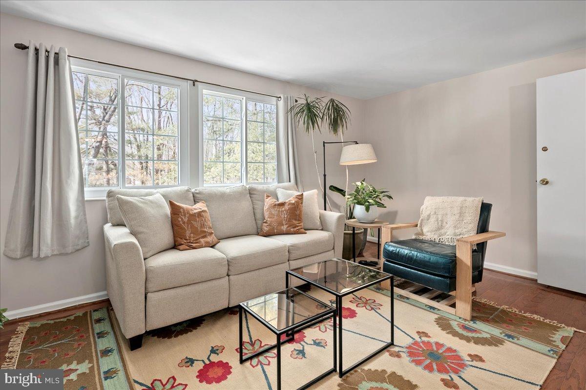 1642 Harvest Green Court Reston, VA 20194 - Photo 21 of 46 a living room with furniture and a window