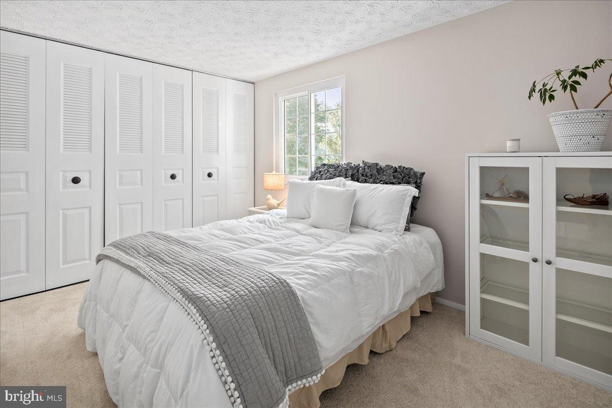 1642 Harvest Green Court Reston, VA 20194 - Photo 23 of 46 a bedroom with a bed and a window