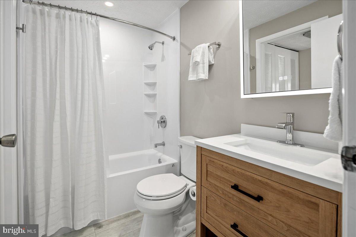 1642 Harvest Green Court Reston, VA 20194 - Photo 25 of 46 a bathroom with a sink a toilet and shower