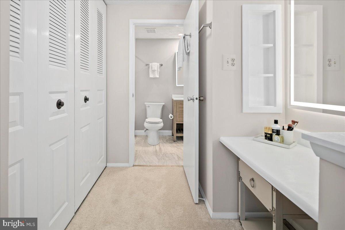 1642 Harvest Green Court Reston, VA 20194 - Photo 32 of 46 a bathroom with a sink vanity granite tub and shower