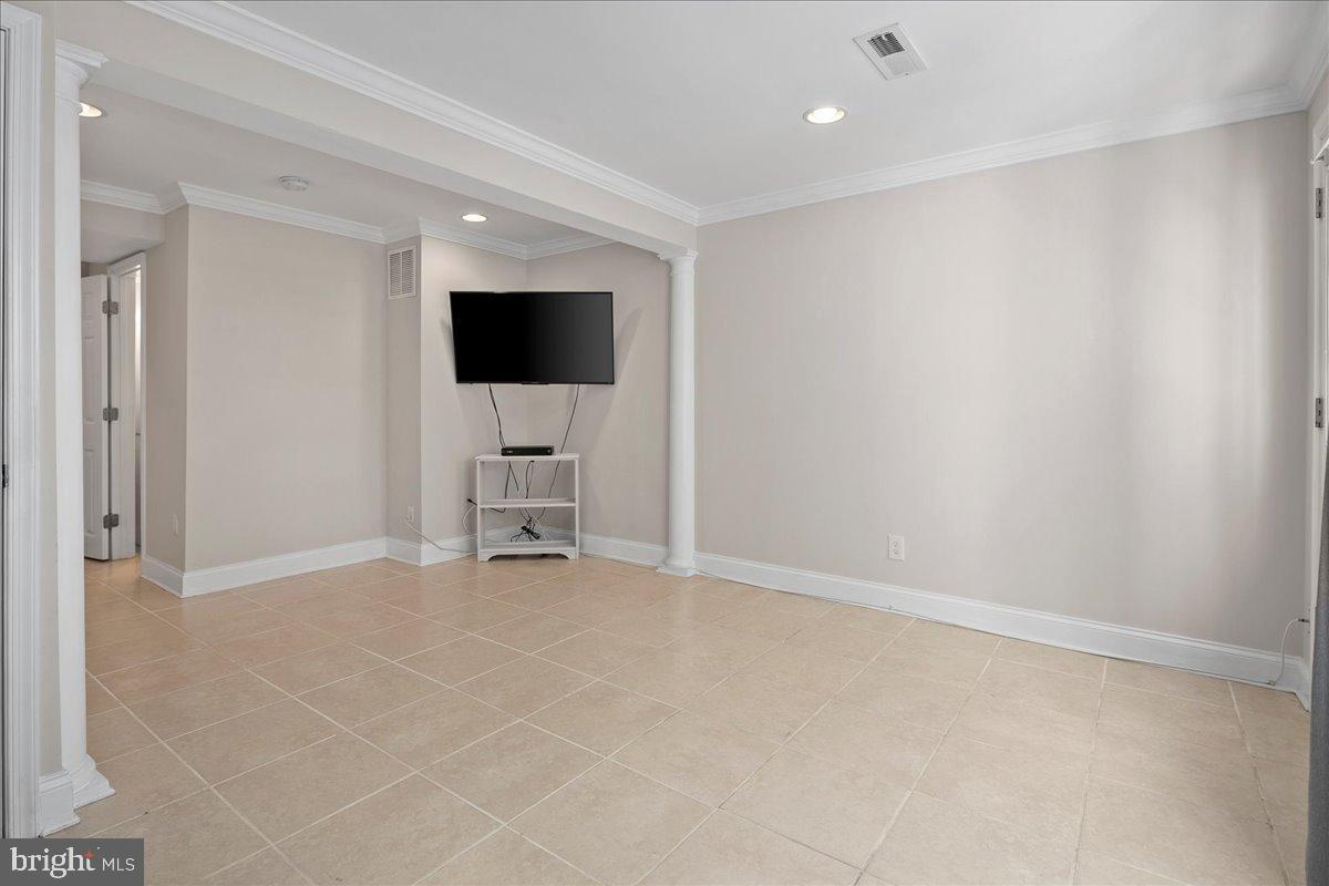 1642 Harvest Green Court Reston, VA 20194 - Photo 36 of 46 a view of an empty room with furniture and a window