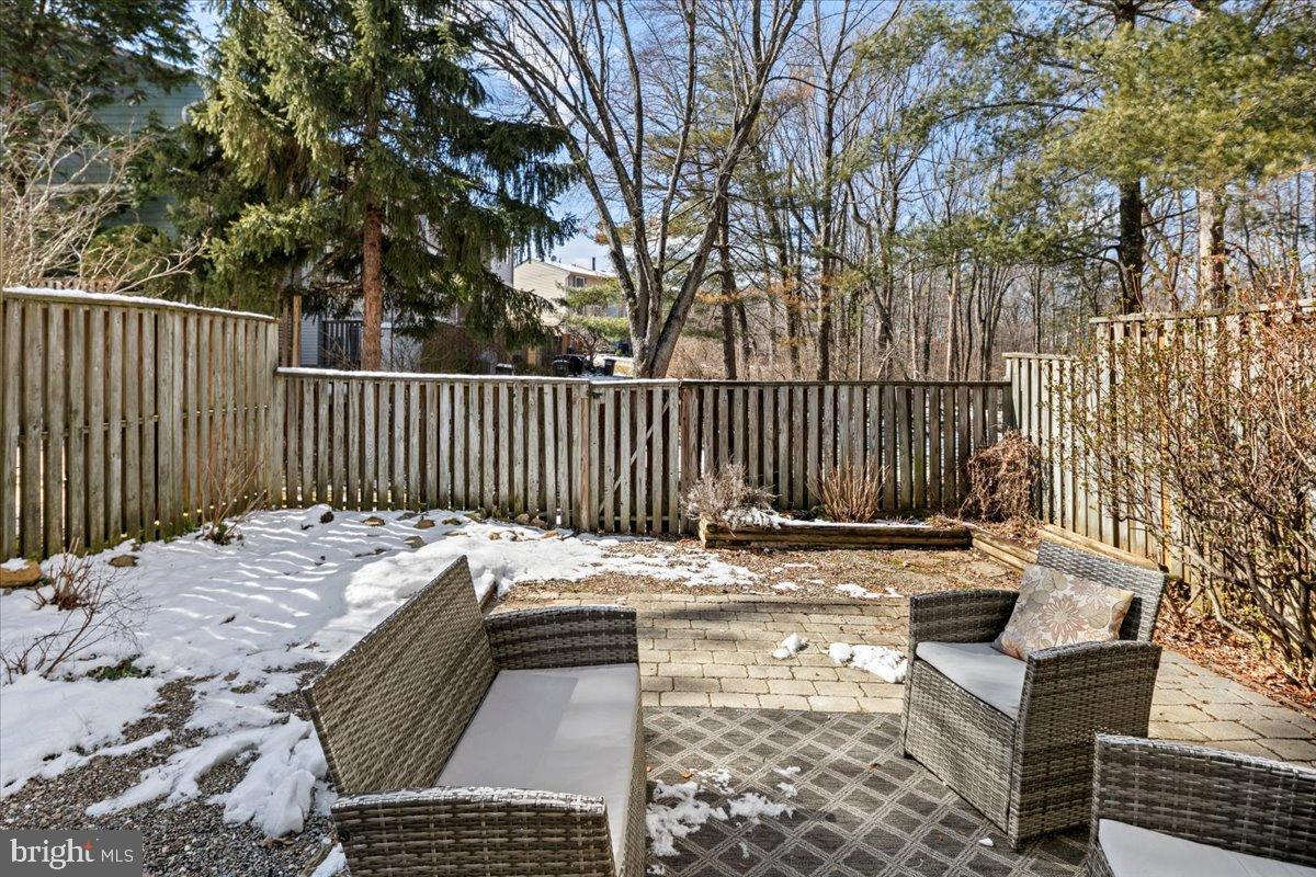 1642 Harvest Green Court Reston, VA 20194 - Photo 39 of 46 a view of a patio with a bench
