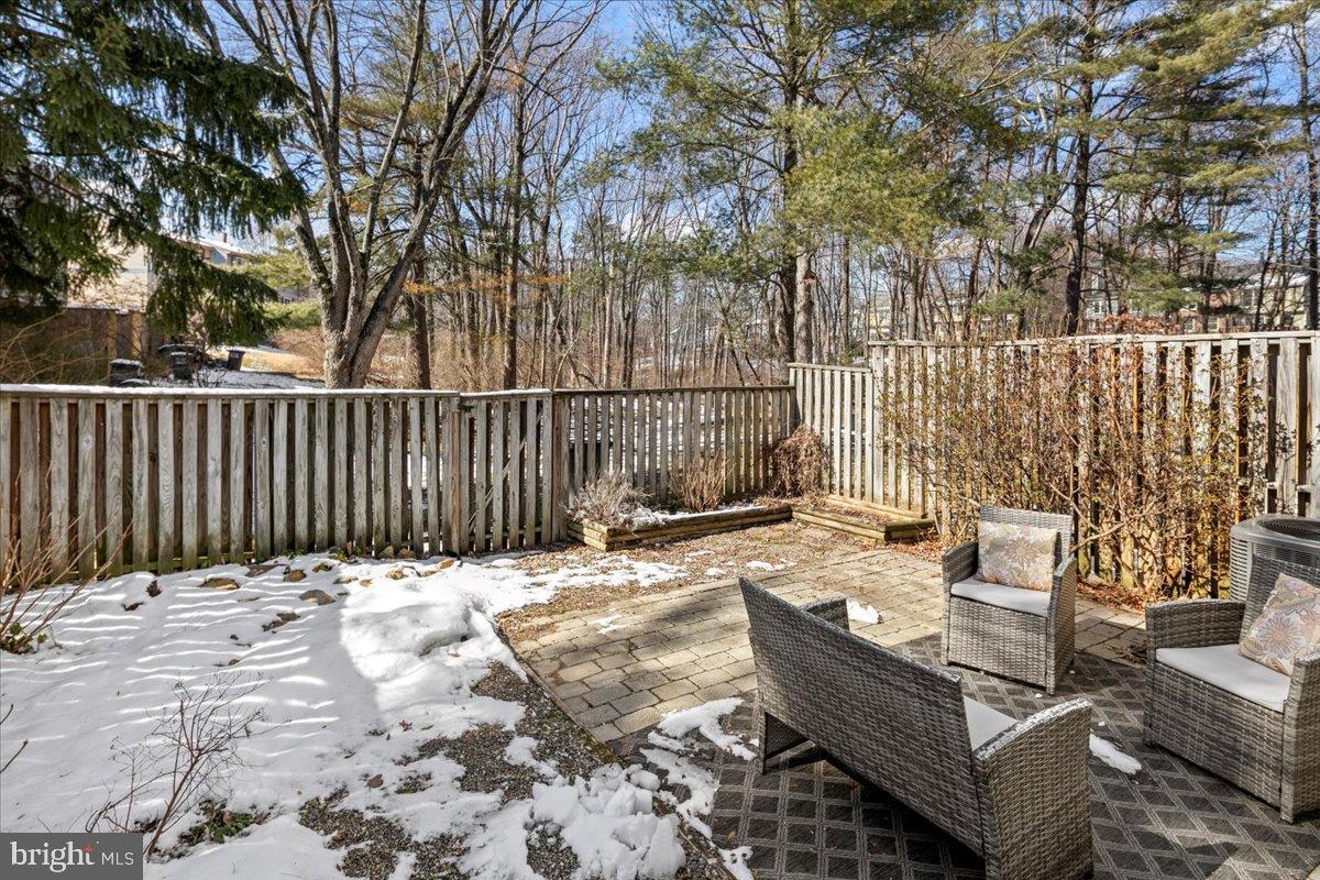 1642 Harvest Green Court Reston, VA 20194 - Photo 40 of 46 a view of a roof deck with wooden fence and a bench