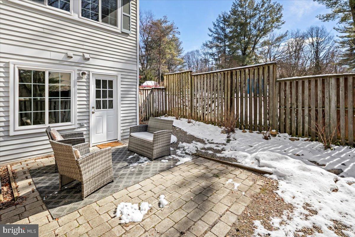1642 Harvest Green Court Reston, VA 20194 - Photo 41 of 46 a backyard of a house with table and chairs