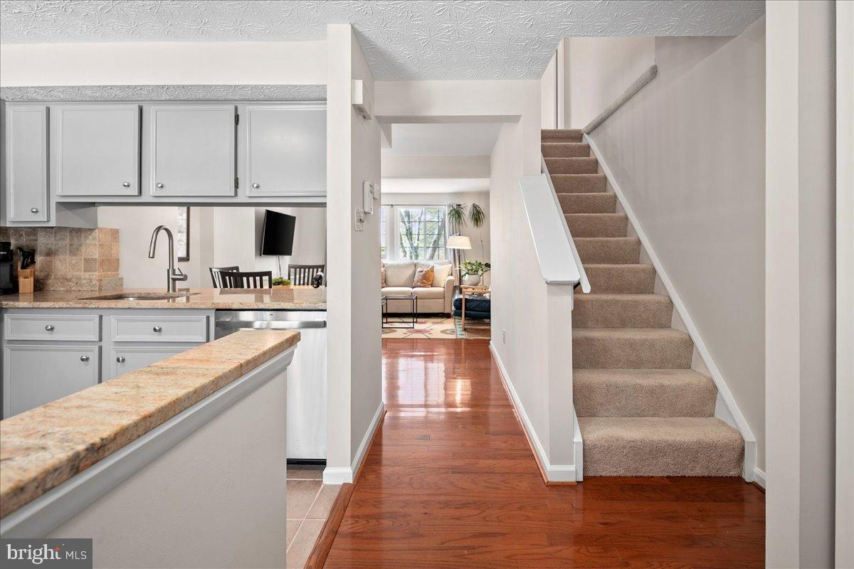 1642 Harvest Green Court Reston, VA 20194 - Photo 8 of 46 a kitchen with white cabinets and sink