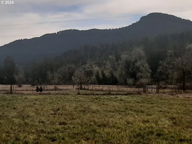a view of a town with mountains
