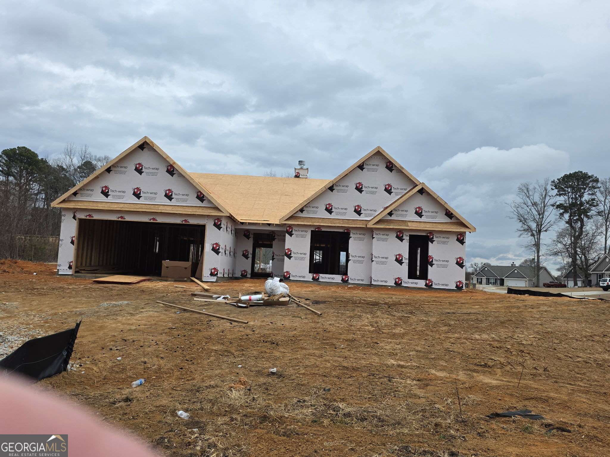 193 Windrow Trail, Unit 46 Statham, GA 30666 - Photo 1 of 5 a large house with a clock tower in middle of front of house