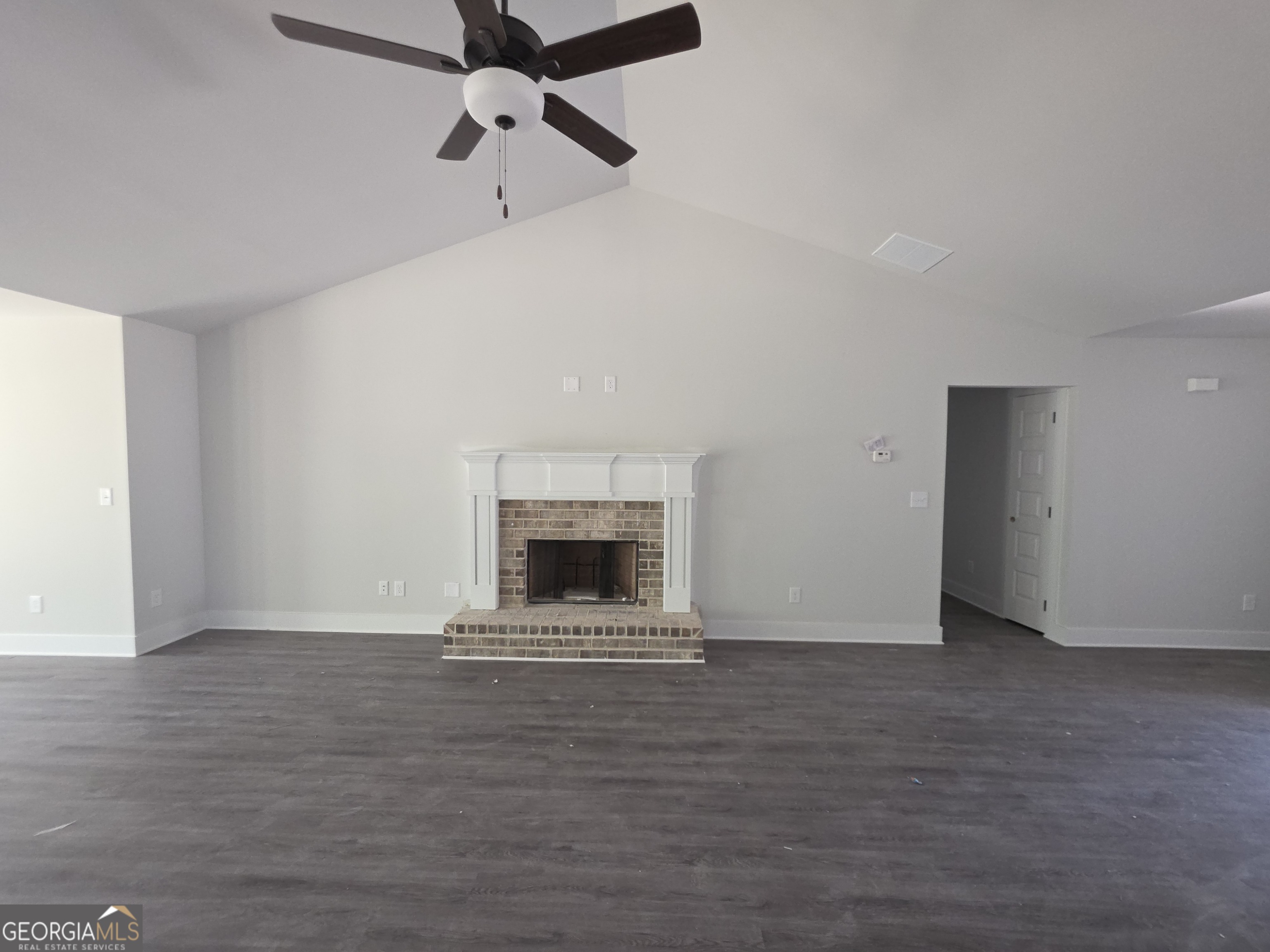 193 Windrow Trail, Unit 46 Statham, GA 30666 - Photo 4 of 5 a view of an empty room with a fireplace