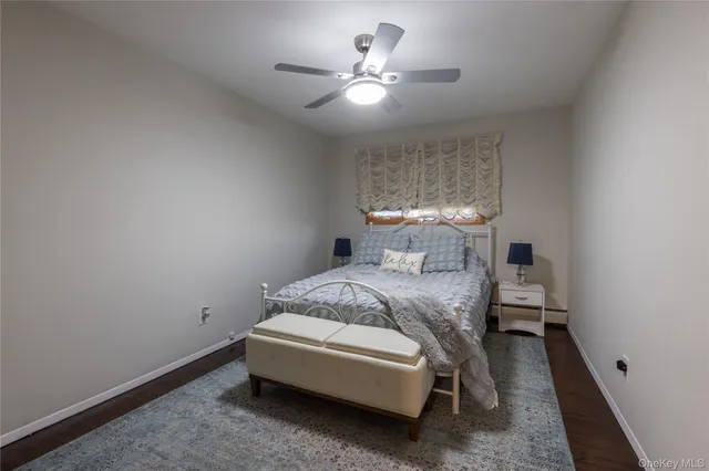 a bed room with a bed and a chandelier