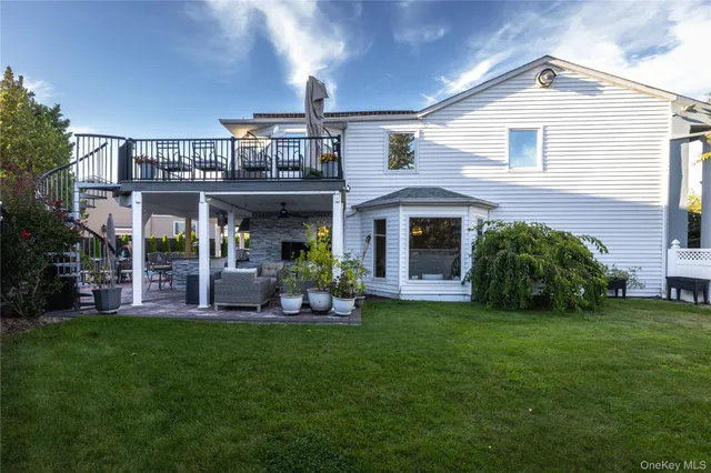 a front view of a house with a yard and porch