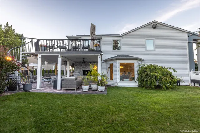 a front view of a house with a yard and porch