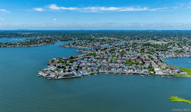 an aerial view of a house with a ocean view