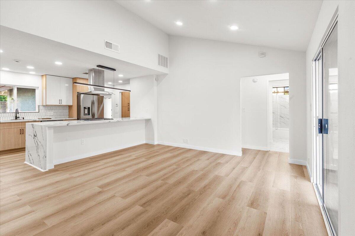 3190 East Vincentia Road Palm Springs, CA 92262 - Photo 13 of 30 a view of a kitchen with wooden floor and windows