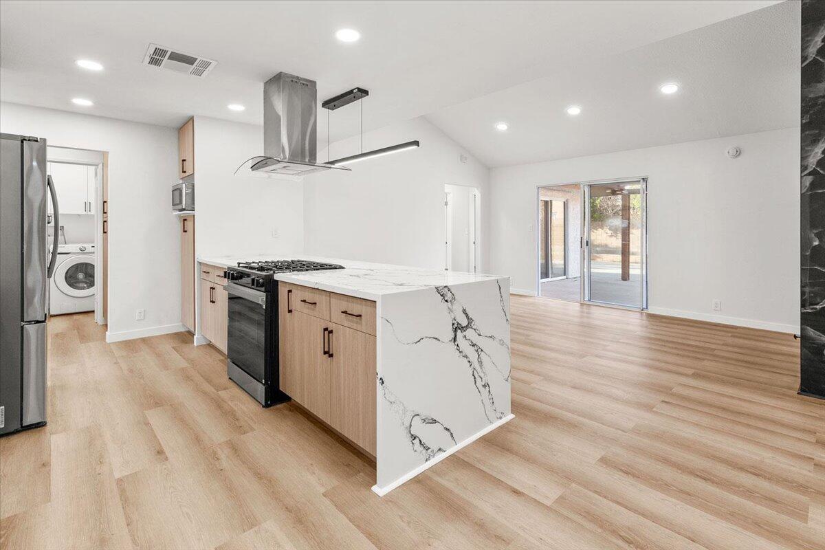 3190 East Vincentia Road Palm Springs, CA 92262 - Photo 16 of 30 a view of a kitchen with stainless steel appliances granite countertop a stove and a refrigerator