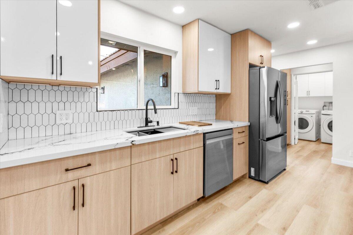 3190 East Vincentia Road Palm Springs, CA 92262 - Photo 17 of 30 a kitchen with a sink cabinets and refrigerator