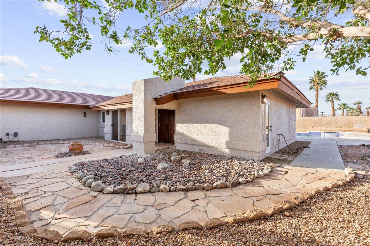 3190 East Vincentia Road Palm Springs, CA 92262 - Photo 6 of 30 a front view of a house with a yard