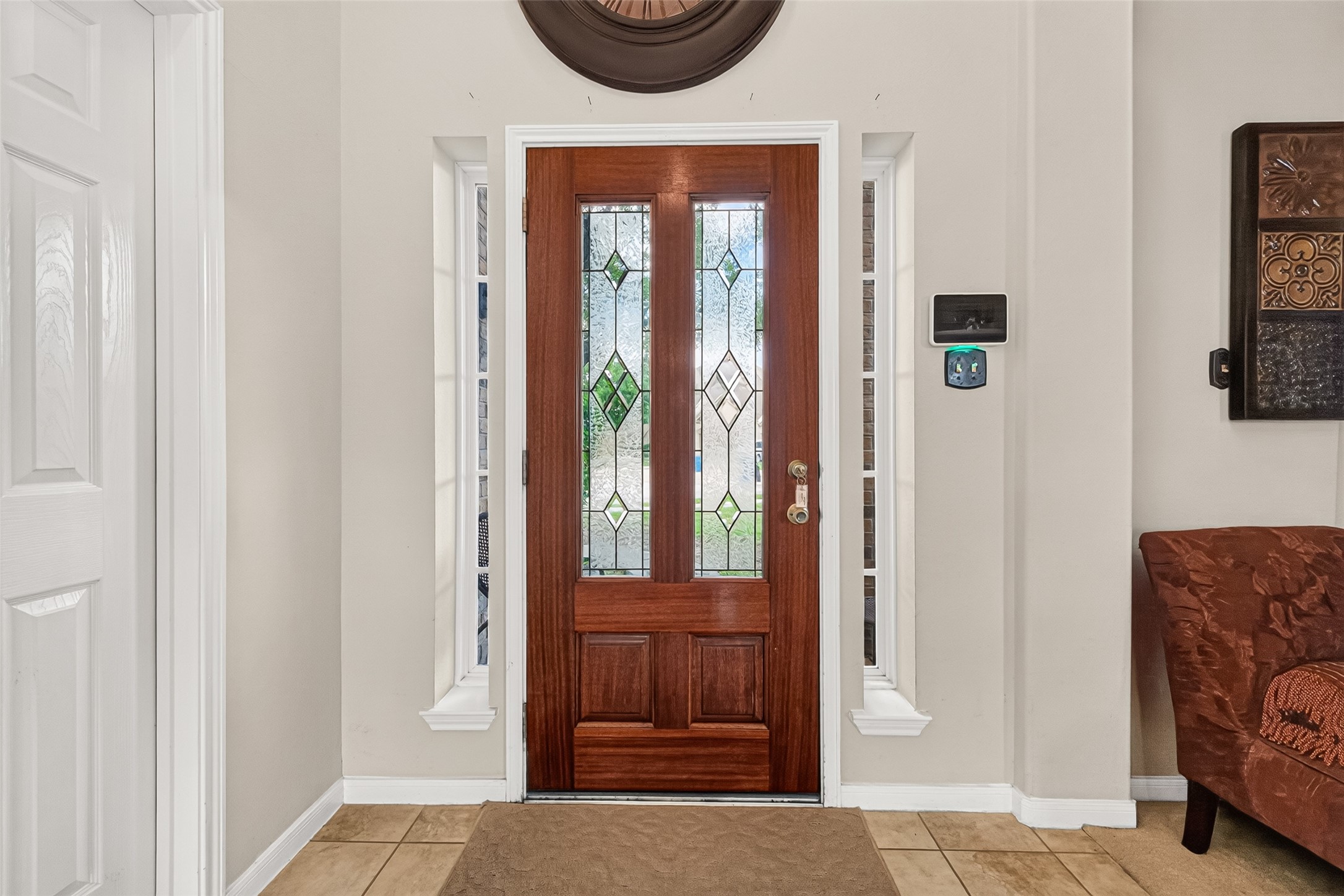 22007 Bridgestone Hawk Court Spring, TX 77388 - Photo 7 of 50 From inside, glass panels and sidelights allow daylight to spill into the entry, brightening the foyer and highlighting the impressive scale of the space.