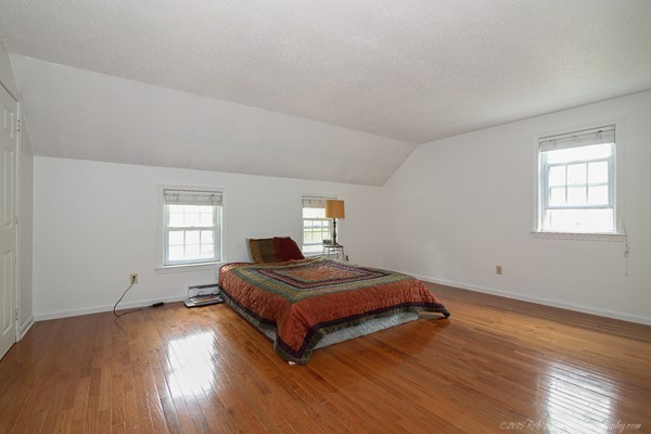 37 Tenney Road Rowley, MA 01969 - Photo 14 of 20 a bedroom with a bed and window